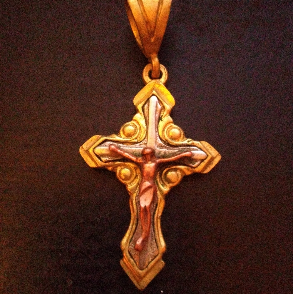 14K Gold Imprinted on the back. It weighs 11.5 grams. Could use some TLC.